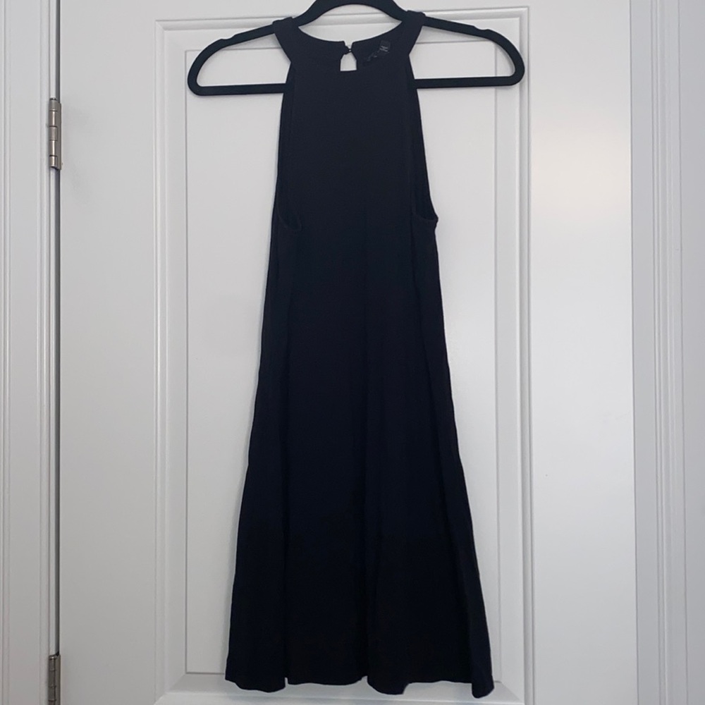 Black high neck sleeveless dress.